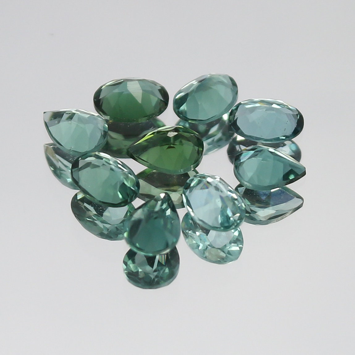 Natural Indicolite Tourmaline Lot 1.25 Carat Oval and Pear Shape Faceted Gemstone 9 Piece Lot