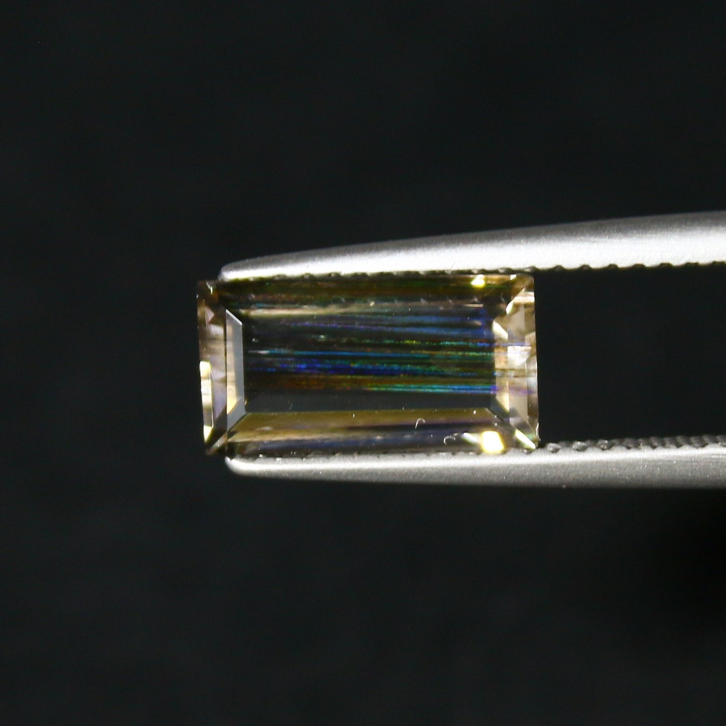 Natural Multi-Fire Rainbow Scapolite 1.91 Carat 10.9x5.7 MM Baguette Shape Faceted Gemstone