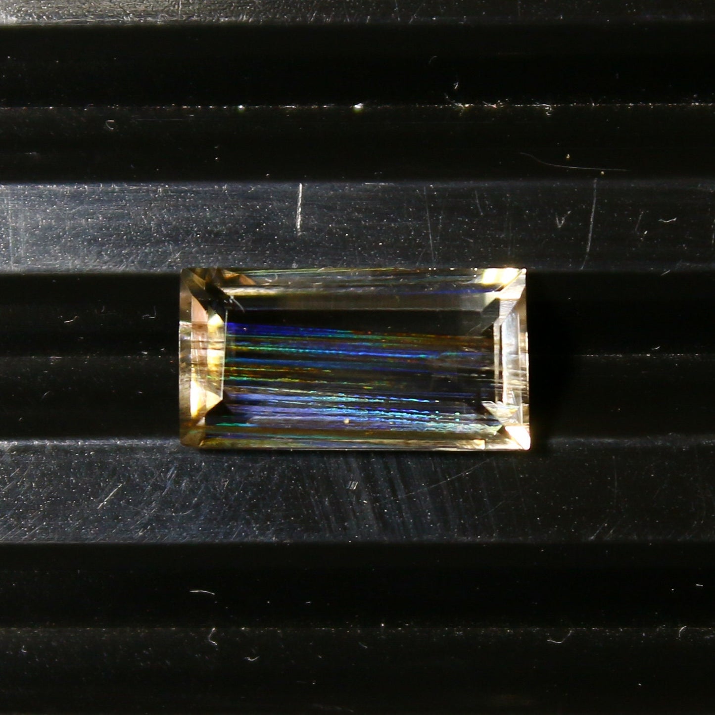 Natural Multi-Fire Rainbow Scapolite 1.91 Carat 10.9x5.7 MM Baguette Shape Faceted Gemstone