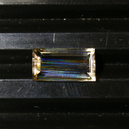 Natural Multi-Fire Rainbow Scapolite 1.91 Carat 10.9x5.7 MM Baguette Shape Faceted Gemstone