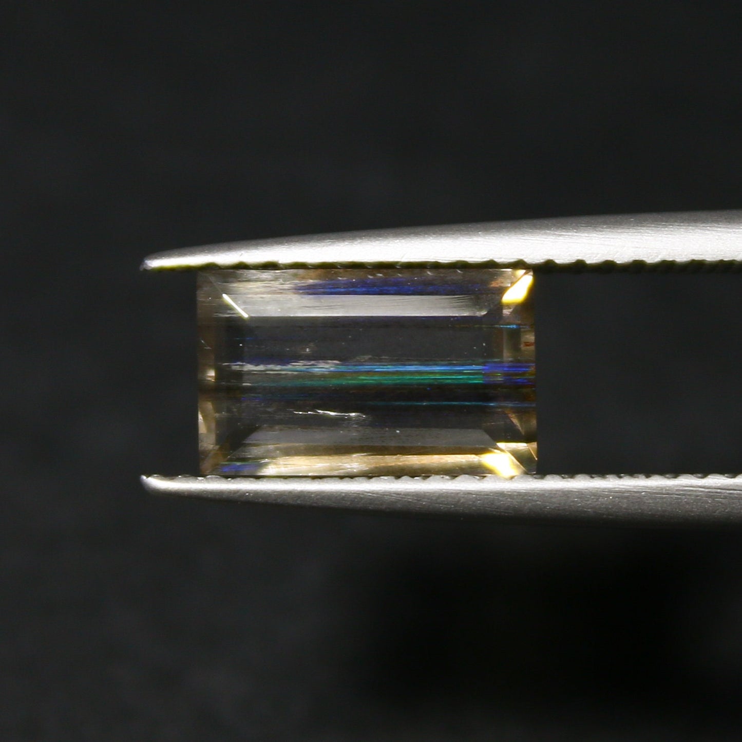 Natural Multi-Fire Rainbow Scapolite 1.59 Carat 9.8x6 MM Baguette Shape Faceted Gemstone