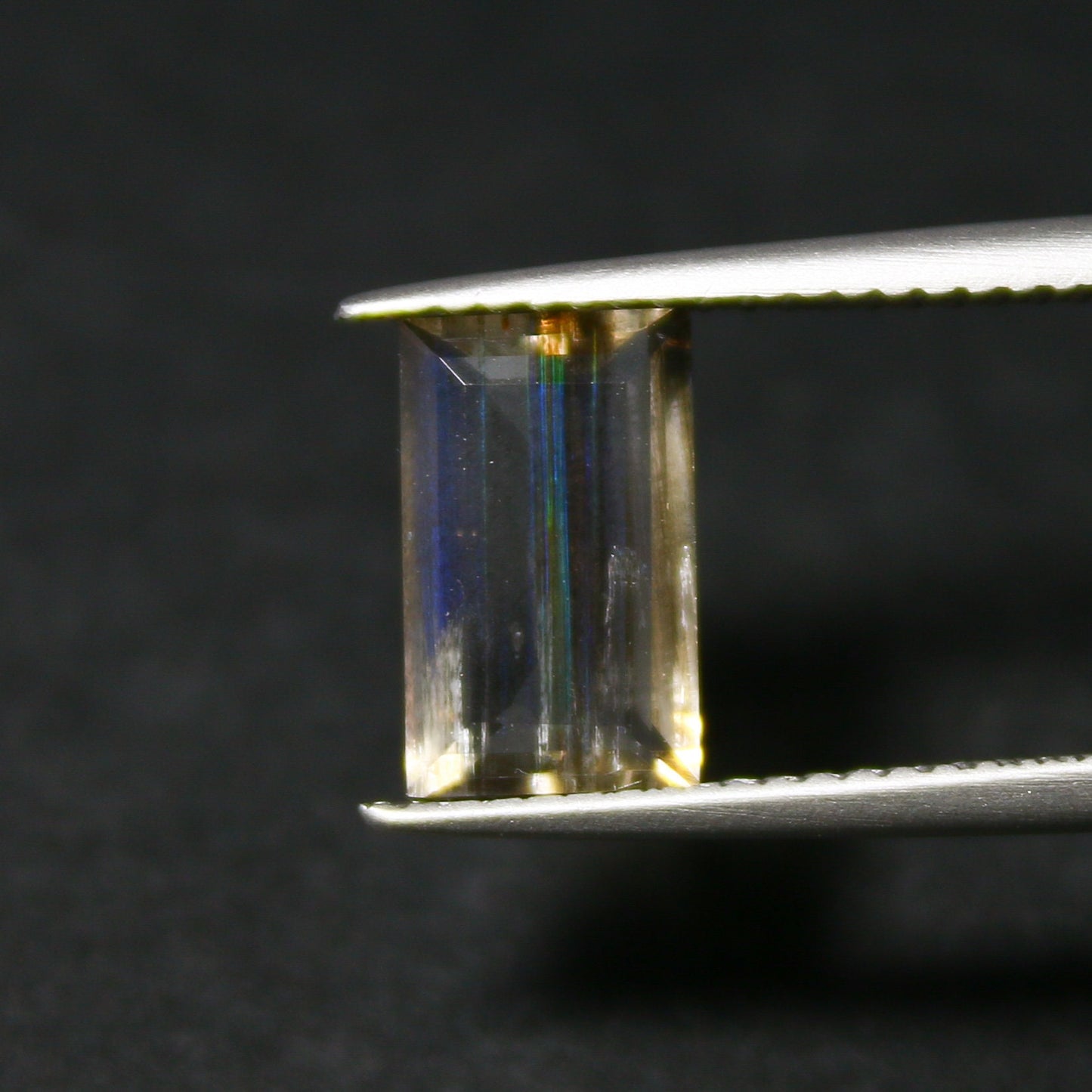 Natural Multi-Fire Rainbow Scapolite 1.59 Carat 9.8x6 MM Baguette Shape Faceted Gemstone