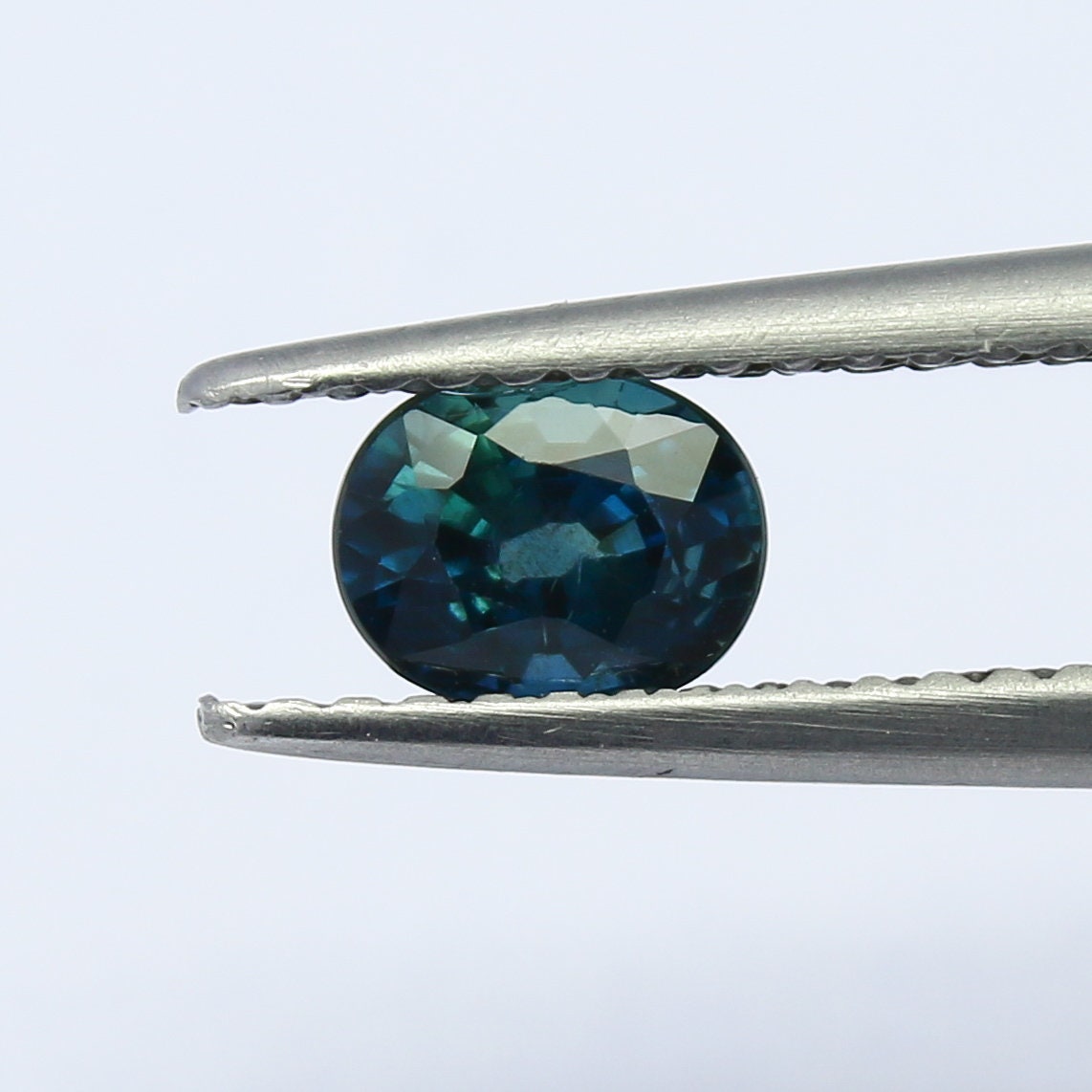 Natural Teal Blue Sapphire 0.67 Carat 5.4x4.2 MM Oval Shape Faceted Gemstone