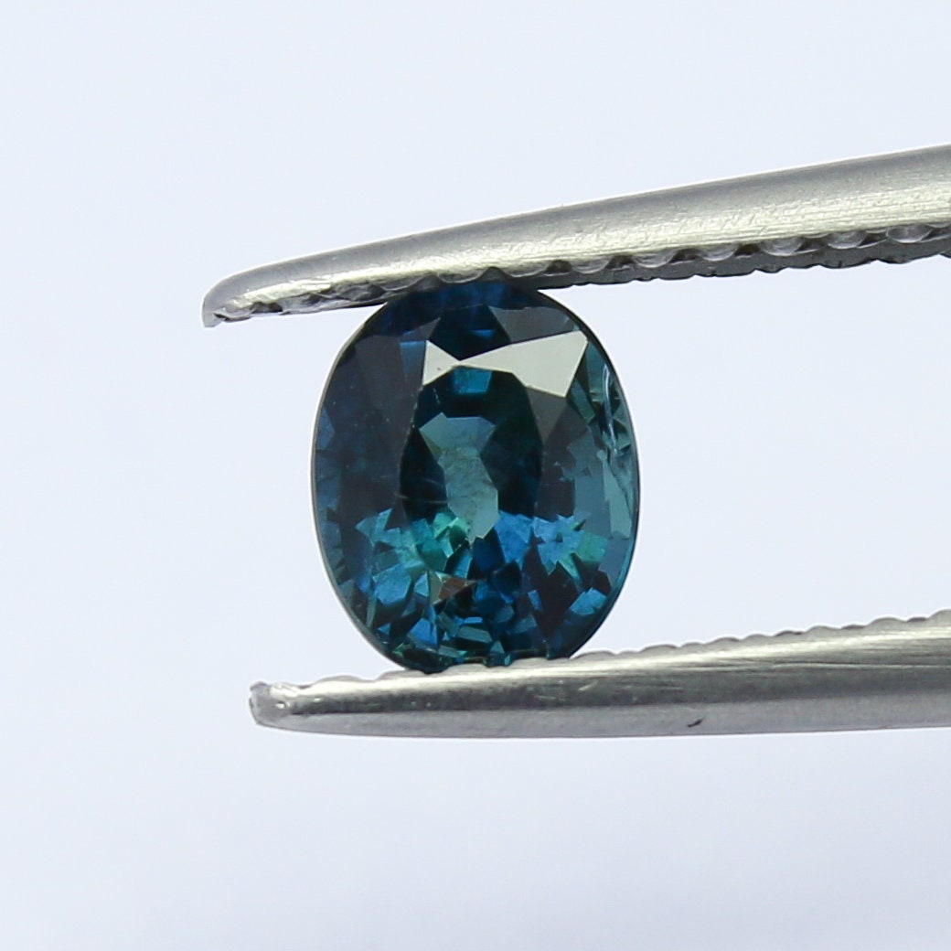 Natural Teal Blue Sapphire 0.67 Carat 5.4x4.2 MM Oval Shape Faceted Gemstone