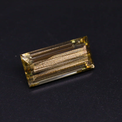 Natural Rare Gold Sheen Scapolite 11.76 Carat 21.1x9.8 MM Baguette Shape Faceted Gemstone